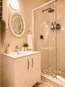 a bathroom with a sink and a shower at Tiah Whyte, Durban in Durban