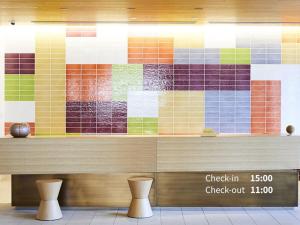 a wall of colorful tiles in a fast food restaurant at Hotel Intergate Kanazawa in Kanazawa