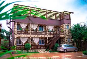 a house with a car parked in front of it at Le Mia KD lodge in Sekondi-Takoradi +2 photos
