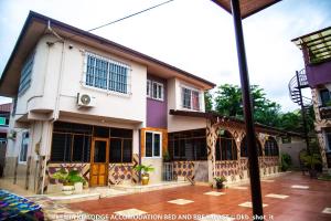 a house in the middle of a street at Le Mia KD lodge in Sekondi-Takoradi