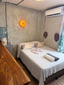 a bedroom with a bed in a tent at Karma Muse Hotel in La Libertad