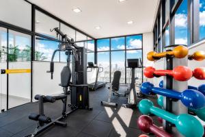 a gym with cardio equipment in a building at Hotel Cassino Tower Piracicaba by Nacional Inn in Piracicaba