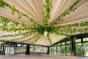 a large tent with a ceiling filled with plants at The Glens Tagaytay in Kaybagal