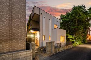 a house that is on the side of a building at THE GRANDEUR in Sapporo