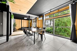 a dining room with a table and chairs at THE GRANDEUR in Sapporo