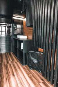 an empty room with a suitcase on a wooden floor at Private Cabin for Quiet, Extended, Freescape Stays in Cavinti