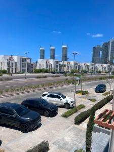 a group of cars parked in a parking lot at العلمين الجديدة in El Dab‘a
