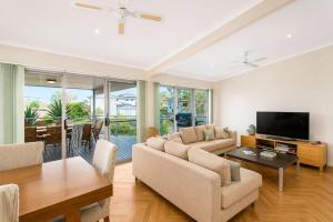 a living room with a couch and a table at Dream Weaver in Bawley Point