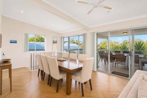 a dining room with a table and chairs at Dream Weaver in Bawley Point