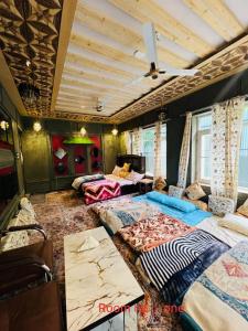 a large room with two beds in it at Aesthetic Homestay in Harganyiwan