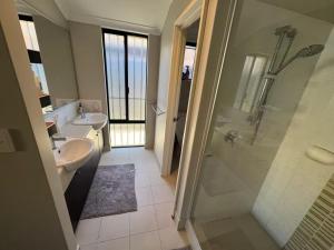 a bathroom with a shower and a sink at Home Sweet Perth in Perth +22 photos