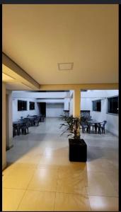a room with tables and benches in a building at Edifício Paris 411 in Lagoa Santa