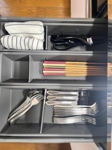 a drawer full of utensils in a kitchen at 御宿空蝉 in Tokyo +26 photos