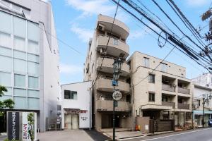a building on the corner of a street at HOTEL CtrlD ASAGAYA Spacious 130 Square Meter Apartment 4 Bedrooms 7 Beds 3 Minute Walk from JR Asagaya Station in Tokyo