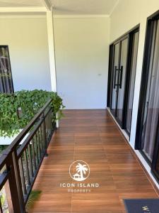 a corridor of a house with a wooden floor at Coco Villa in Hinkong