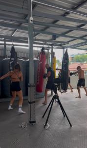 a group of people with surfboards and a camera at Top Residence Patong in Patong Beach