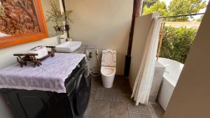 a bathroom with a toilet and a tub and a sink at Elephant House and Pool Villas in Ban Sop Ao +117 photos