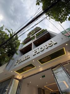 a building with a sign that reads palm house at Palm Hotel in Tam Kỳ