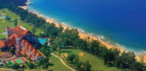 an aerial view of a resort near the beach at Tiktoki Apartment 15C Kijal in Kijal