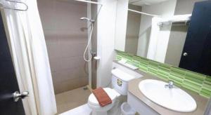 a bathroom with a sink and a toilet and a mirror at U Style Hotel in Ban Phang Khwang Tai +165 photos