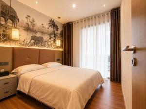 a bedroom with a large bed and a large window at Axis Residences Apartment in Phumĭ Prêk Chrey +41 photos