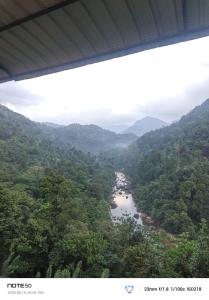 a view of a river in the middle of a valley at Adventure Manor in Kitulgala