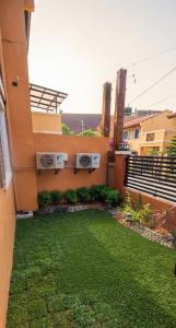 a view of a building with a yard at Nicholas Residence in Silang