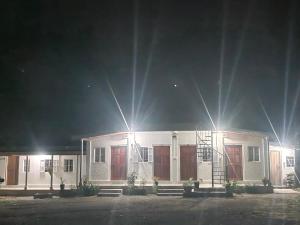 a white house with lights on top of it at Peter and Paul Homestay in Shillong