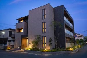 a building on a city street at night at ReLA Minami-Nagareyama in Nagareyama