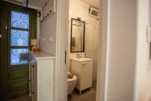 a bathroom with a toilet and a sink and a window at Casa Nora in centre of Vodnjan - Happy Rentals in Vodnjan