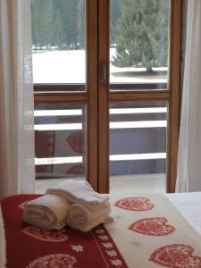 A bed or beds in a room at Hotel Stella Alpina