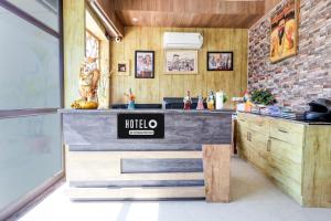 a kitchen with a counter in a room at Hotel O Uttaranchal University Dehradun in Jhājra