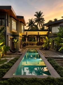 a house with a swimming pool in front of it at Islaya Siargao on Opening Phase in General Luna +20 photos