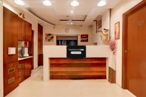a lobby with a large wooden garage door at Townhouse Oak Ramdaspeth Downtown in Nagpur