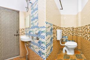 a bathroom with a toilet and a sink at Hotel O AIIMS Raipur in Raipur