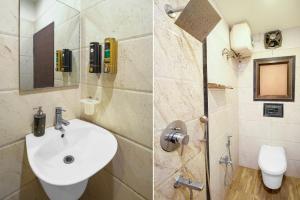 a bathroom with a sink and a toilet at Collection O Downtown Hospital Guwahati Formerly Cherry City Cottage in Guwahati