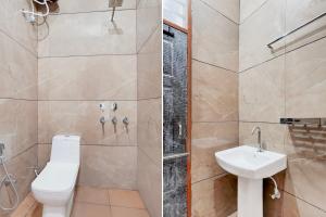 a bathroom with a toilet and a shower and a sink at Super Hotel O by OYO ISBT Mohali Formerly Holiday Spot in Mohali
