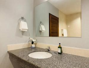 a bathroom with a sink and a mirror at iCheck inn Phuket Town in Phuket