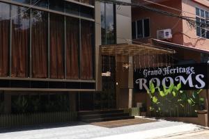 a building with a sign on the side of it at Grand Heritage in Ernakulam