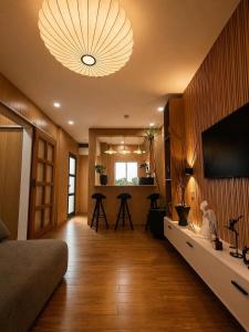 a large living room with a large chandelier at Casa Andrea Bukidnon in Impasugong