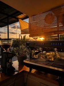 a kitchen with a counter with a blender and a counter top with a counter top at Casa Andrea Bukidnon in Impasugong