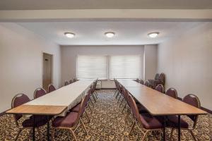 a conference room with a long table and chairs at Quality Inn & Suites Lawrence - University Area in Lawrence