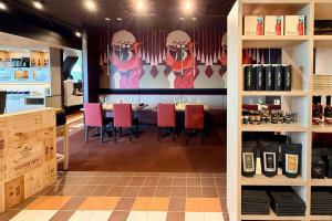 a restaurant with a table and chairs in a room at Quality Inn & Suites Temiscouata-sur-le-Lac in Notre-Dame-du-Lac