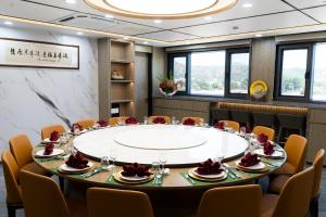 a meeting room with a large table and chairs at Timor Plaza Hotel & Apartments in Dili