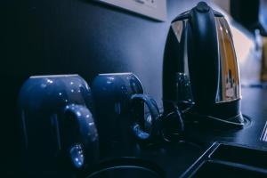 a group of blue mugs sitting on a counter at Hotel RAAGA INN in Tirupati +22 photos