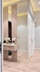 a hallway with a large mirror in a room at High Town City in Lunacharskiy Bekati +21 photos