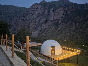 a dome tent with lights on top of a mountain at Glamping Yeghegis in Yeghegis