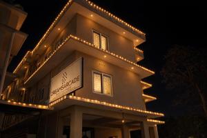 a building with lights on top of it at night at Dreams Arcade in Nedumbassery +12 photos