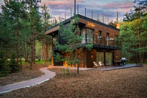 a house in the middle of a forest at Dziupla House in Czarna