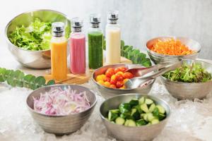 a table topped with bowls of different types of vegetables at ANA Crowne Plaza Matsuyama by IHG in Matsuyama